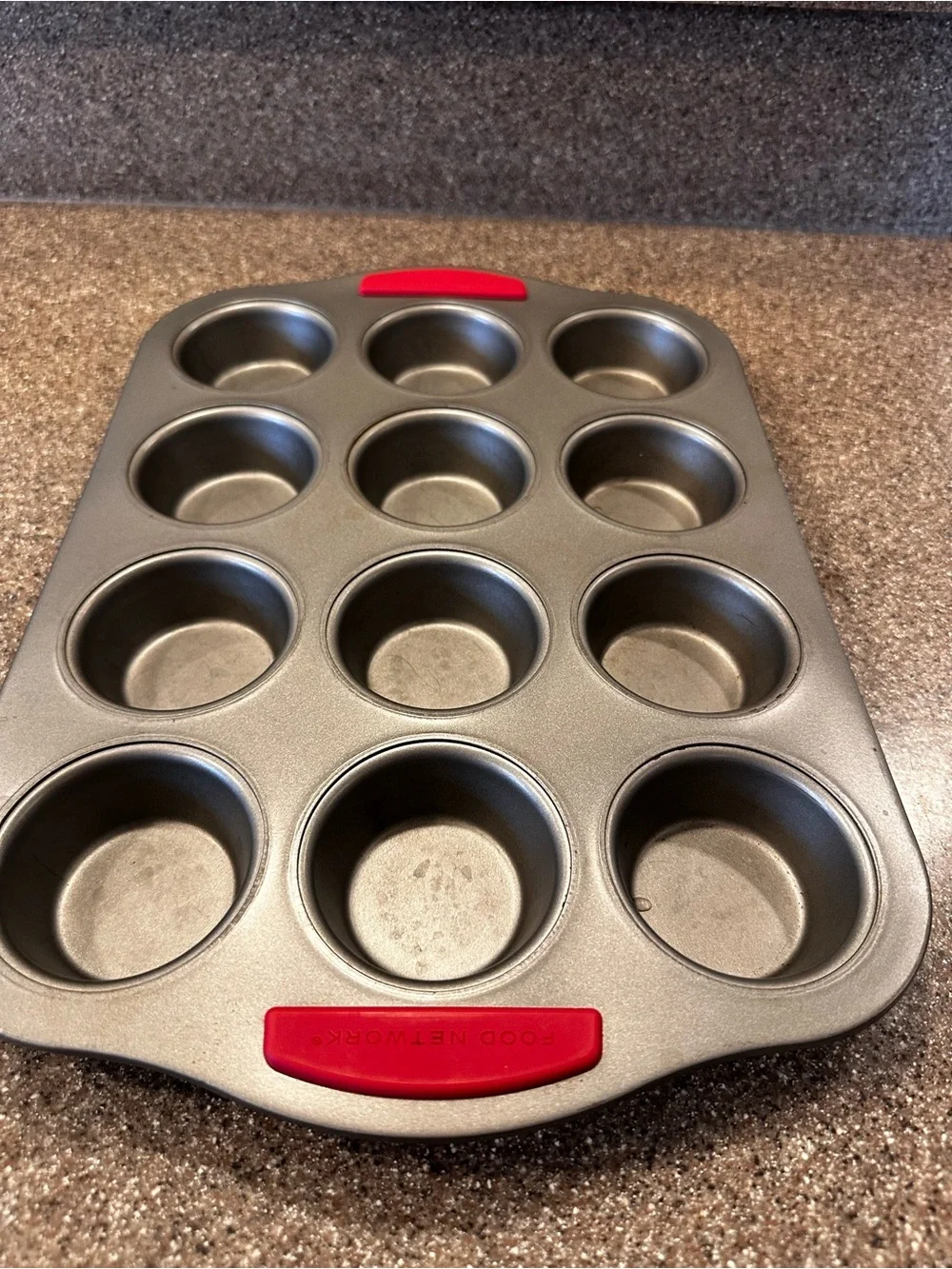 Food Network 12-Cup Gray Muffin Pan with Red Silicone Grips